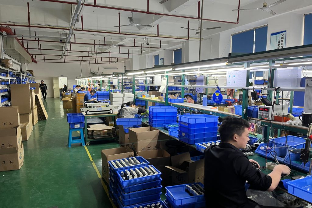 JOHOPE employees working with printer components